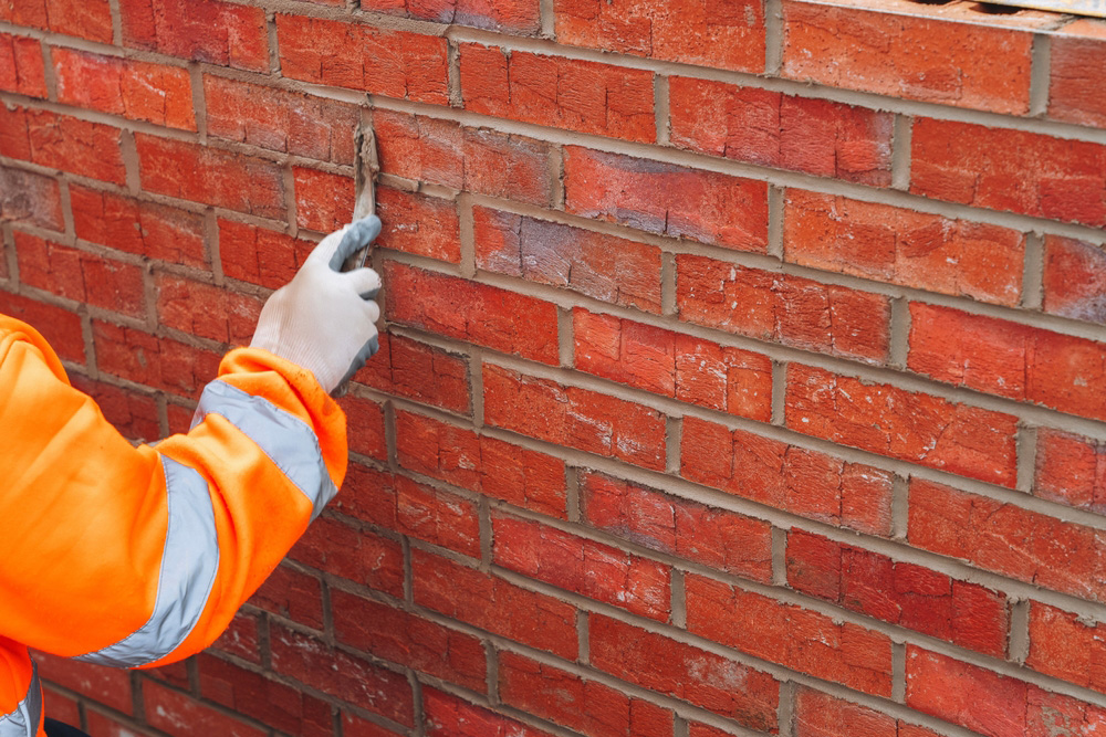 Brick pointing and repointing in Brooklyn on a residential brick building